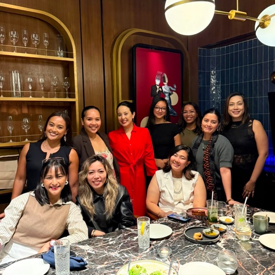 Women gathered around a dinner table